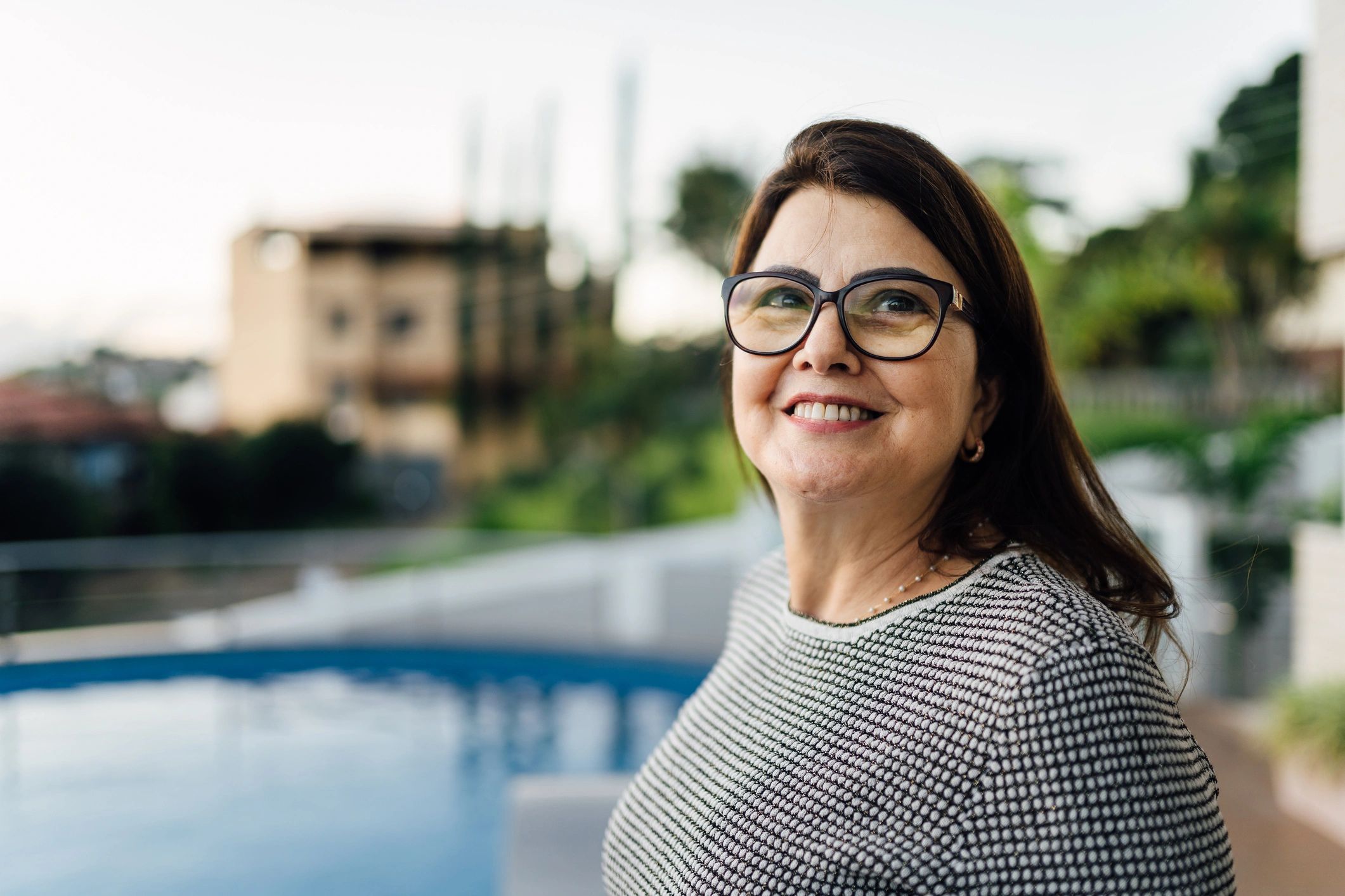 smiling customer portrait outdoor pool