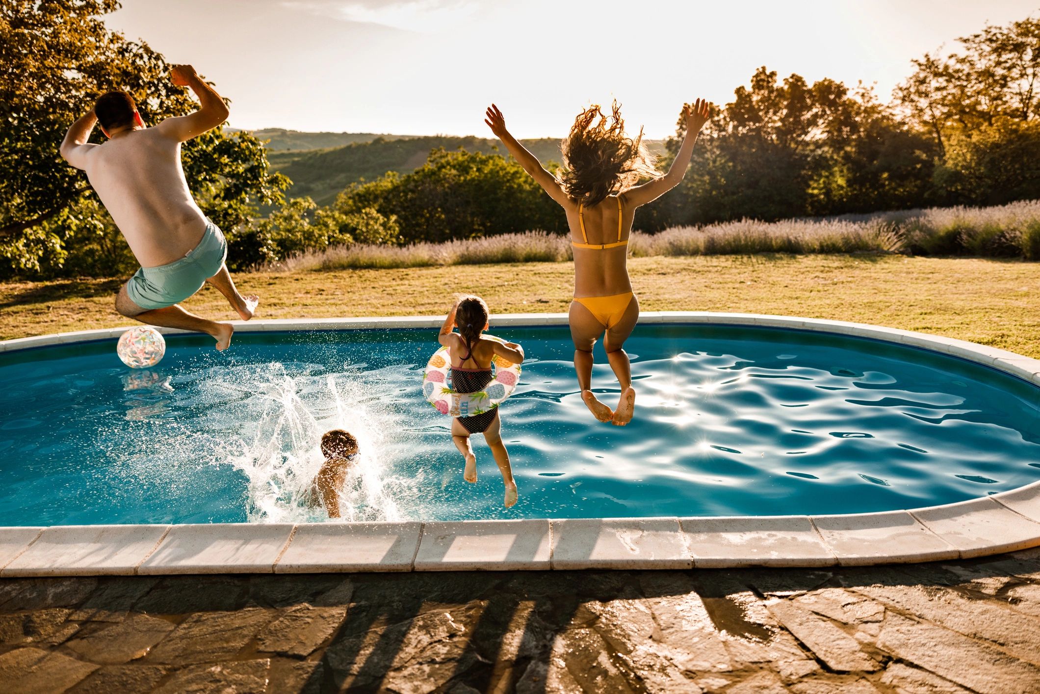 happy family swimming pool backyard
