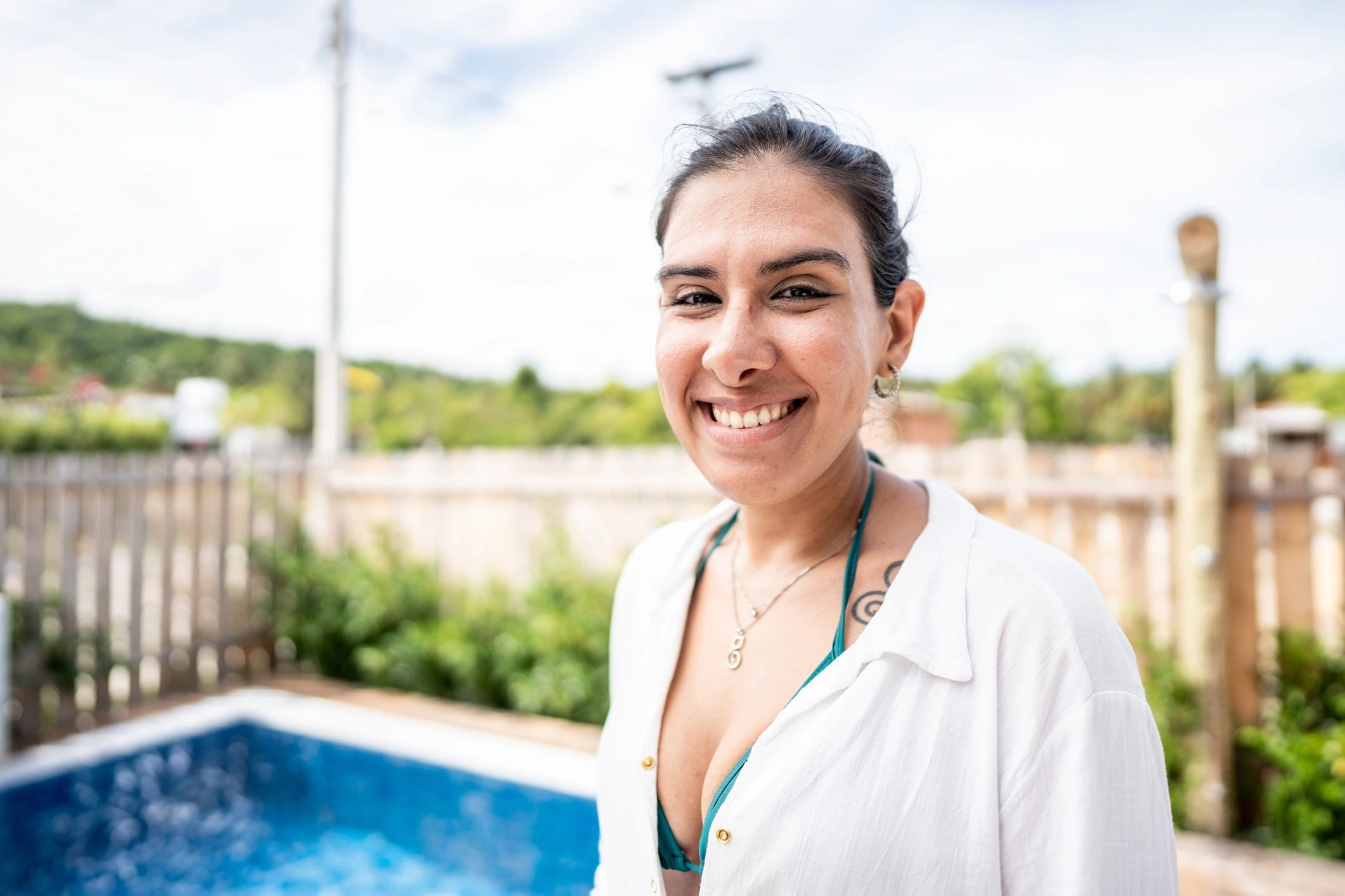 smiling customer portrait outdoor pool