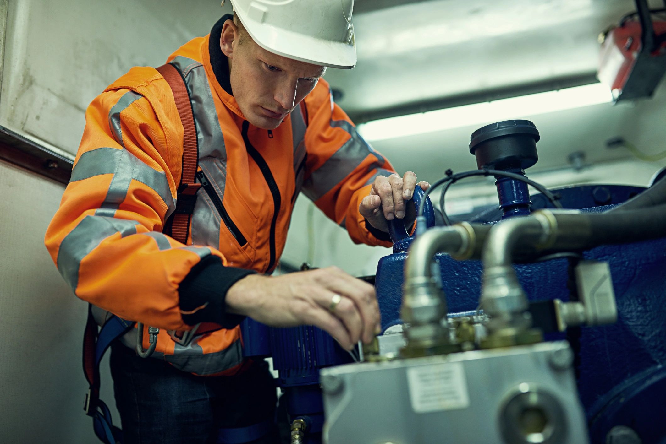 pool technician repairing equipment