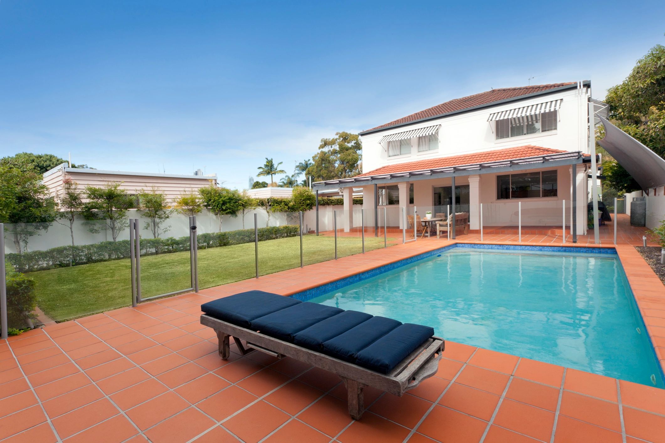 bright clean Brisbane backyard pool ready for regular monthly service
