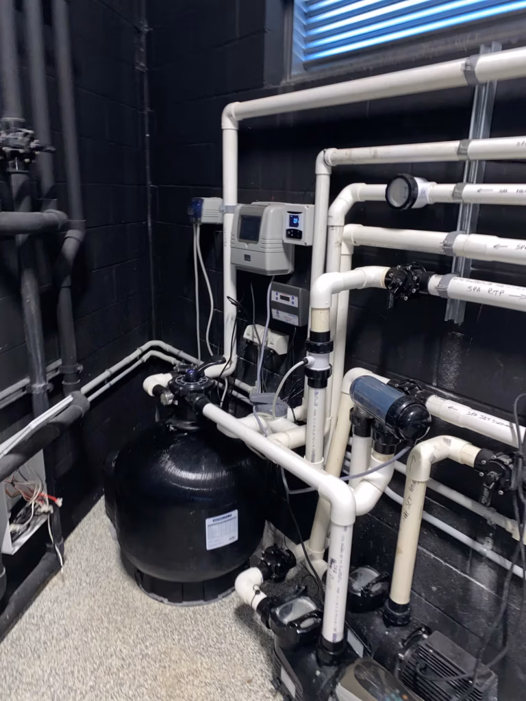 pool service Brisbane technician diagnosing pool equipment